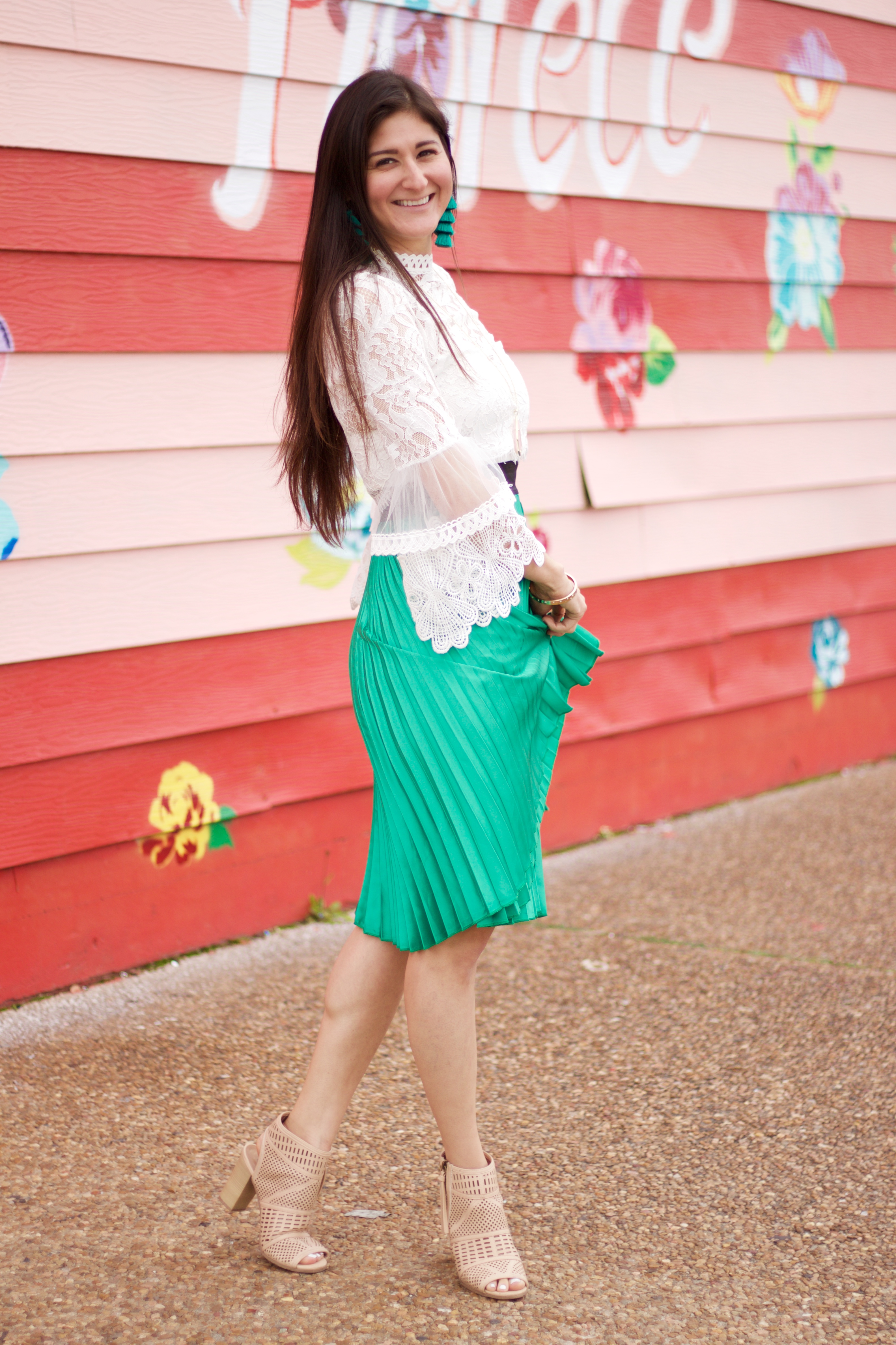 The Fashionable Maven Jenni Metz modeling a green pleated skirt