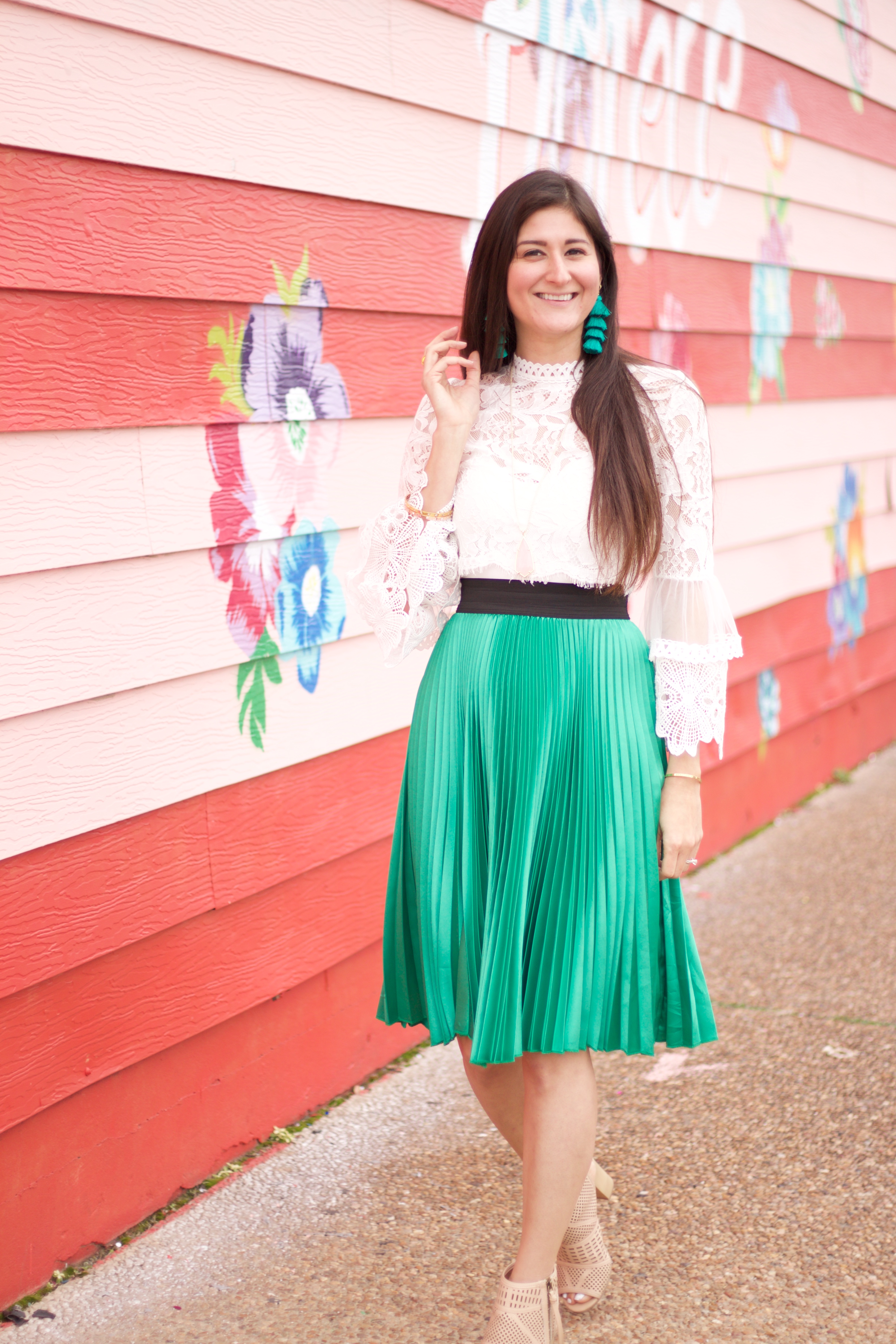 Jenni Metz The Fashionable Maven wearing pleated skirt and lace crop top.