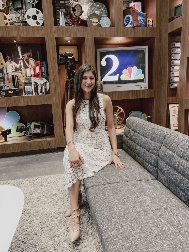 Jenni Metzler sitting in the studio at KPRC channel 2. White 3 tier dress. Spring dress fashion. Houston Life Segment. 