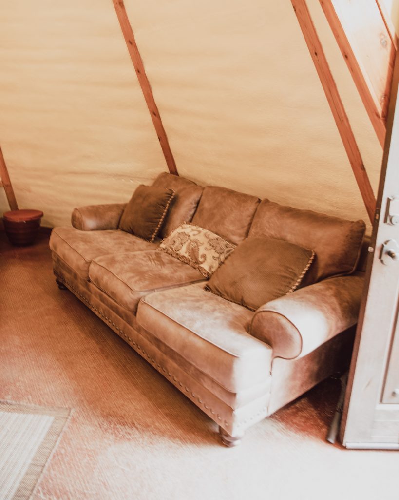 Couch inside of the Tipi camping tent. New Braunfels, Texas