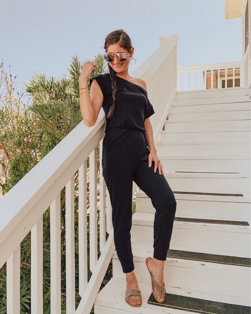 Jenni Metz wearing a black off the shoulder jumpsuit from Amazon. 