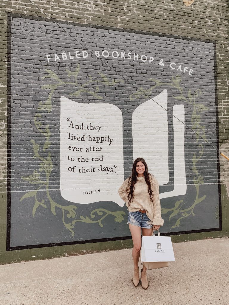 Fabled Bookshop and Cafe Waco, TX. Fashion blogger Jennifer Metzler wearing knit sweater and distressed shorts. 