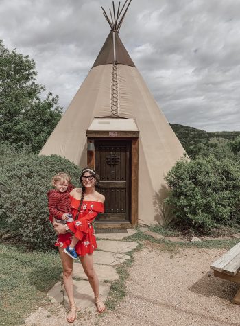 Mom and son standing in front of Tipi used for camping in New Braunfels TX