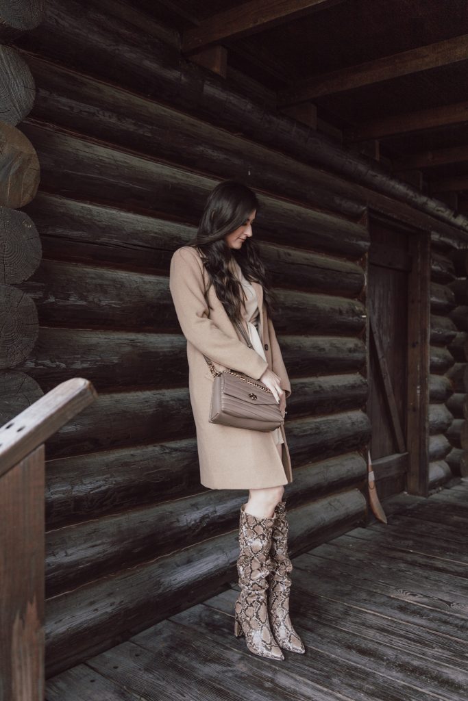 Snake print boots, tan coat, and tan dress outfit, worn by Jenni Metzler.