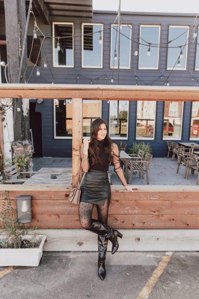 Jenni Metzler wearing a faux leather skirt, sharing how to style fall outfits for women in their 30s.