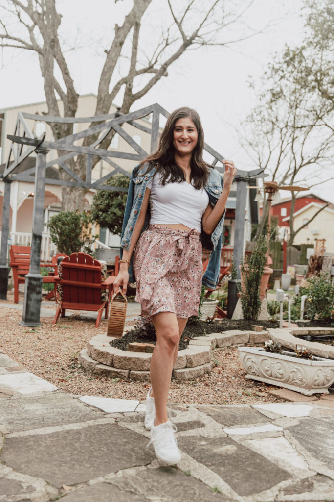 Cute spring outfits 2021: Jenni Metz wearing a wrap crop top and floral mini skirt.