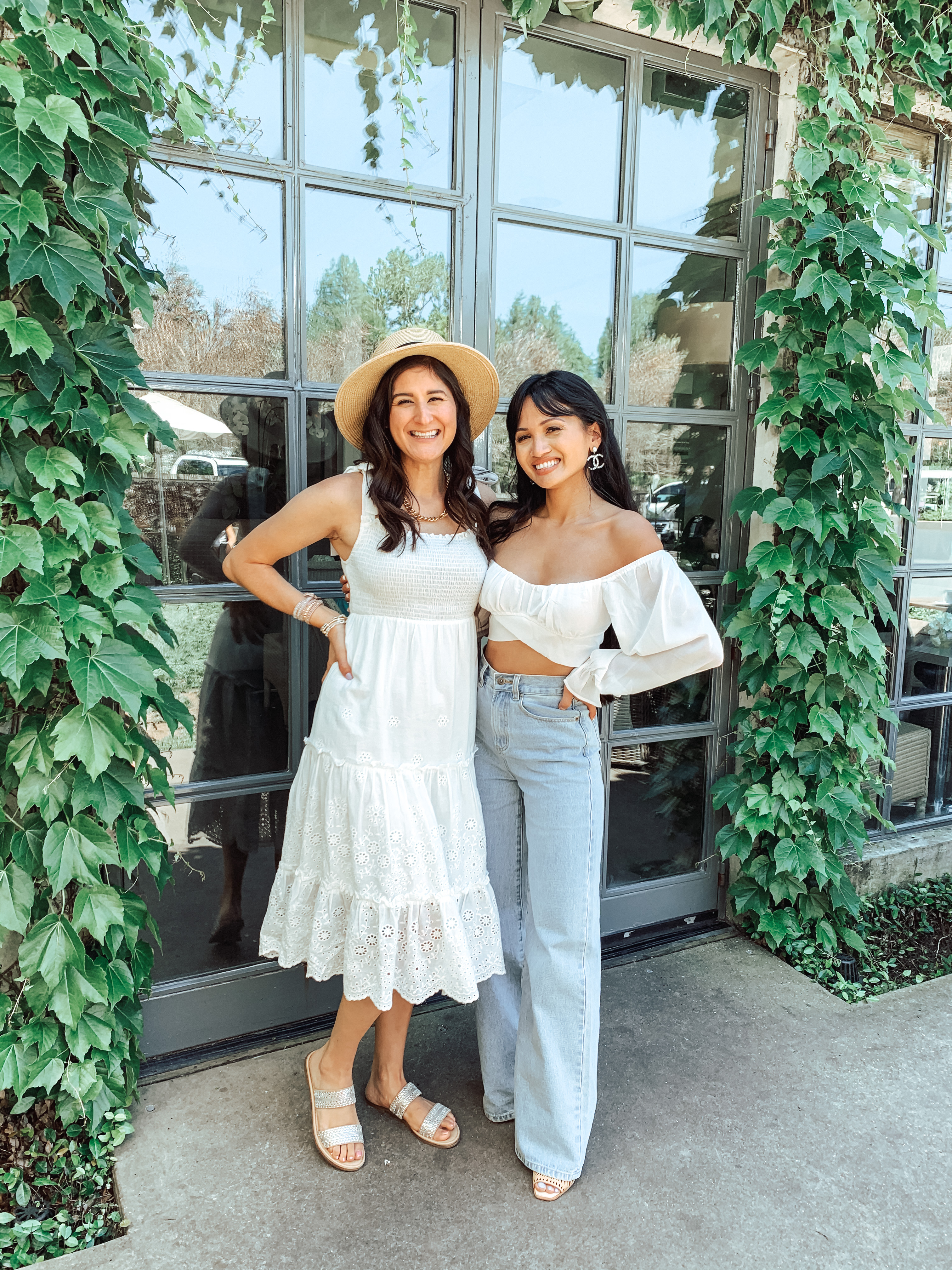 Jenni Metz and Dawn Darnell at Tiny's in Houston. Cute Spring outfits blog post. Wearing a white maxi dress and a white crop top & jeans.