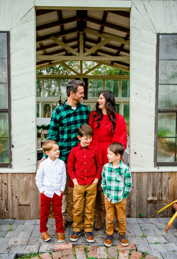 Family matching Christmas outfits: One family wearing different Christmas outfits that coordinate. TFM