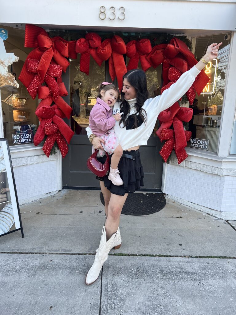 mom and daugher wearing cowboy boots and skort outfits