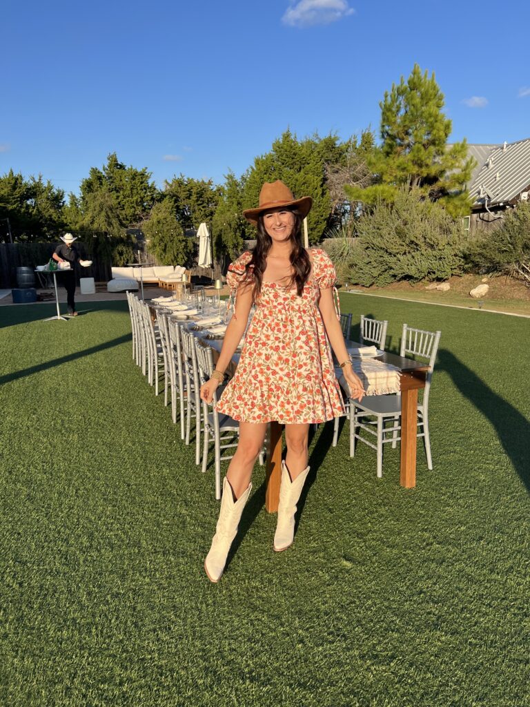 Flowy midi dress outfit for wine tasting in Fredericksburg Texas Cowboy boots